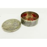 An early 20th century, Thai silver niello circular box and cover.