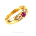 An 18 ct carat yellow gold, ruby cabochon and diamond ring