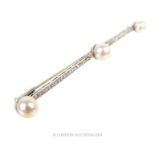 An elegant, French, Art Deco, platinum, diamond and pearl bar brooch