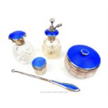A collection of five sterling silver and blue guiloche enamel dressing table items