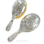 A matching Edwardian sterling silver hand mirror and hairbrush