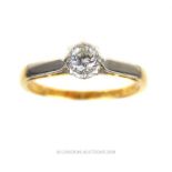 An 18 ct yellow gold and platinum, diamond solitaire ring.