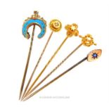 Five, antique, yellow gold stick pins