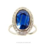 A platinum, French, vintage, large oval sapphire and diamond ring