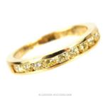 A 9 ct yellow gold, diamond, half-set eternity ring