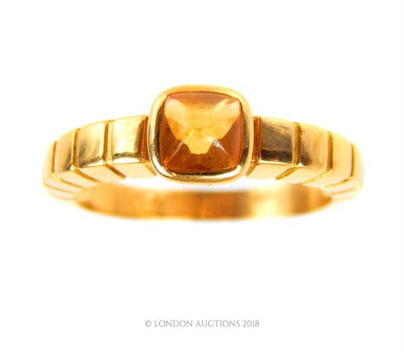 An 18 ct yellow gold, sugar loaf cut citrine, '22' ring by Van Cleef and Arpels