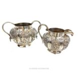 An Indian silver milk jug and sugar bowl