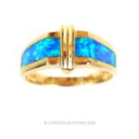 A 14 carat yellow gold and blue opal matrix ring