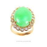 An 18 ct yellow gold, vintage, French, large green cabochon and diamond ring