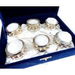 A cased set of six Oman sterling silver bangle design napkin rings