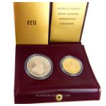 A cased, 22 ct yellow gold, Belgian 50 ECU coin and silver coin