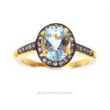 A silver-gilt, aquamarine and diamond ring