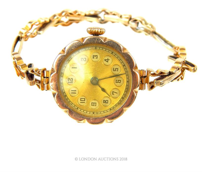 A vintage, 9 ct yellow gold wristwatch and strap