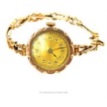 A vintage, 9 ct yellow gold wristwatch and strap