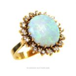 An 18 ct yellow gold, large opal and diamond cluster ring