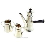 An Edwardian three piece sterling silver bachelors hot chocolate set