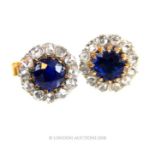 A pair of sapphire (1.28ct total) and diamond stud earrings.