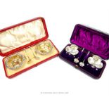 Two cased pairs of Victorian sterling silver cruets