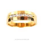 A 14 ct yellow gold and seven diamond ring