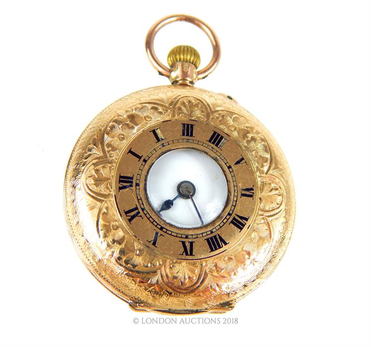 A 9 ct yellow gold, half hunter pocket watch with finely engraved case