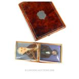 A 19th century, yellow gold, rectangular frame containing portraits