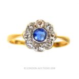 An 18 ct yellow gold, diamond and sapphire cluster ring