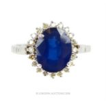 An 18 ct white gold, French, 1960's, sapphire and diamond cluster ring
