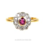 An 18 ct yellow gold and platinum, diamond and ruby cluster ring