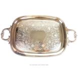 A silver plated twin handled tray, made in Sheffield