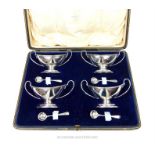 A cased set of four sterling silver salts, with spoons