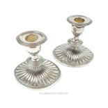A pair of attractive, silver plated, candlesticks by Falstaff in the neo-classical taste