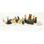 A collection of figures of cats, dogs and hedgehogs,