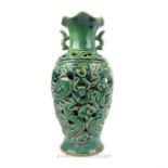 A Chinese, crackle-glaze, green vase with pierced allover decoration