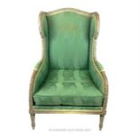 A 19th century French wing back armchair