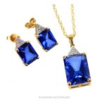 A boxed, elegant, 9 ct yellow gold, diamond and blue stone suite of jewellery