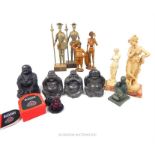 A collection of figures including a number of Buddhas, Don Quixote, and others