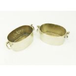 A pair of oval silver plated wine coolers