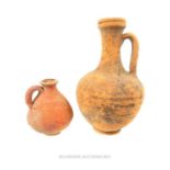 Two Roman terracotta, handled jugs