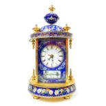 A 20th century cloisonne domed table clock with Roman numeral enamel dial and hand painted decorated