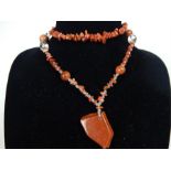 A goldstone and clear crystal necklace