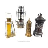 A vintage Tilly lamp and three storm lanterns.