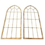 A pair of Gothic style arched mirrors