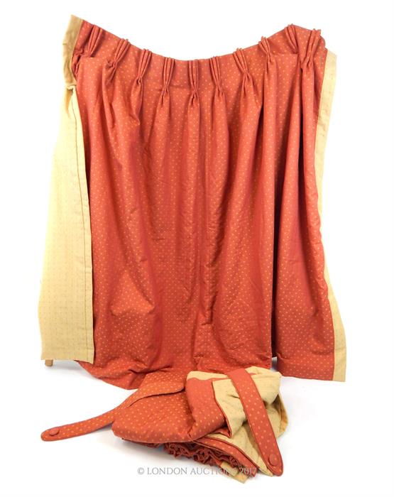 A pair of fine quality, lined curtains in a terracotta and cream, heavy cotton fabric