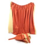 A pair of fine quality, lined curtains in a terracotta and cream, heavy cotton fabric