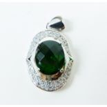 A sterling silver, green stone and cubic zirconia pendant
