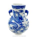 A large, Chinese, hand-painted blue and white vase