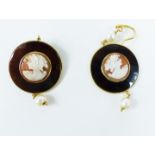 A pair of silver gilt earrings set with cameos on hardstone discs, adorned with pearls