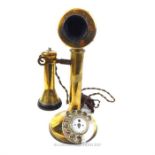 A stylish, early 20th century, brass telephone with hand-held speaker