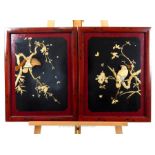 Two Japanese lacquered panels with carved bone relief birds; overall size 55cm x 42.5cm.