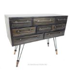 An industrial style metal bank of drawers